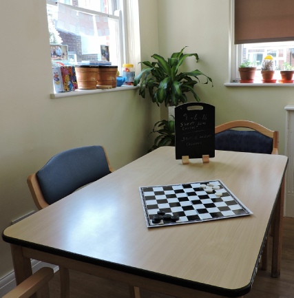 Chessboard on table showing activities in Care Home